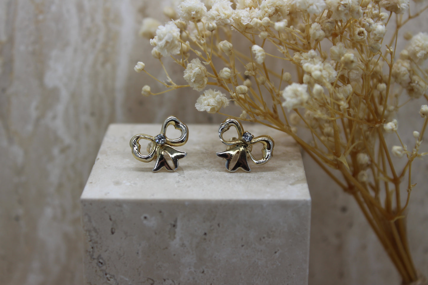 Gold diamond bow earrings