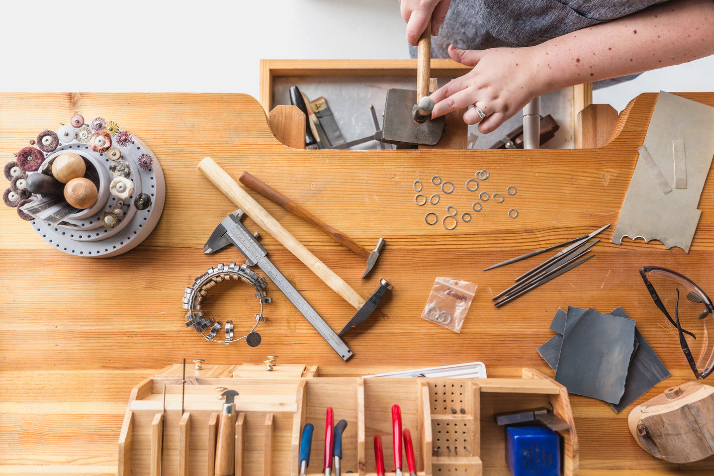 Jewellery workbench in workshop, making rings