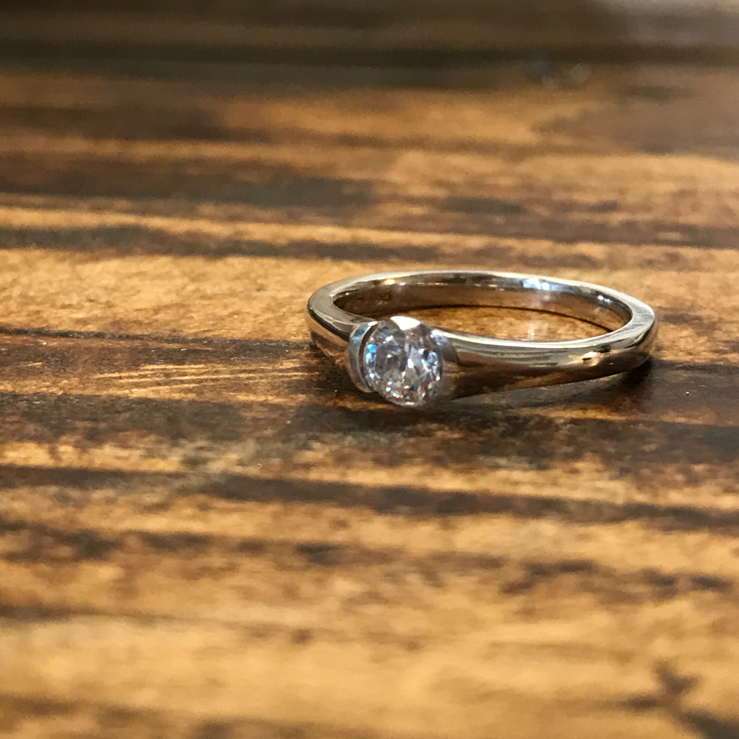 Silver and single stone CZ ring